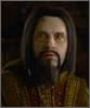 Still image from the film, of Unferth, who has long black hair and a goatee beard