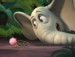 Animated image of an elephant watching ants carry a pink flower along the ground