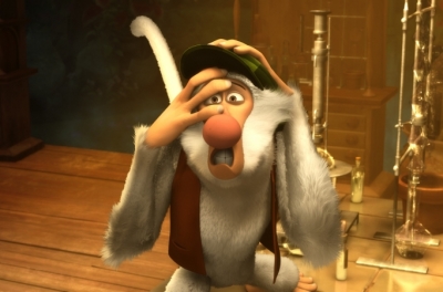 An animated monkey wearing a hat and waistcoat covers his face with his paws