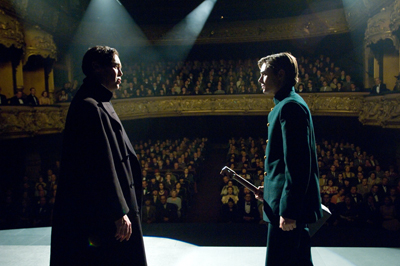 Medium shot of two actors on stage, facing each other