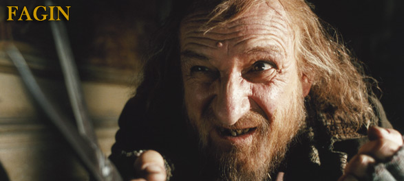 Fagin graphic - close-up of Fagin, his face withered and screwed up as he talks to someone out of shot